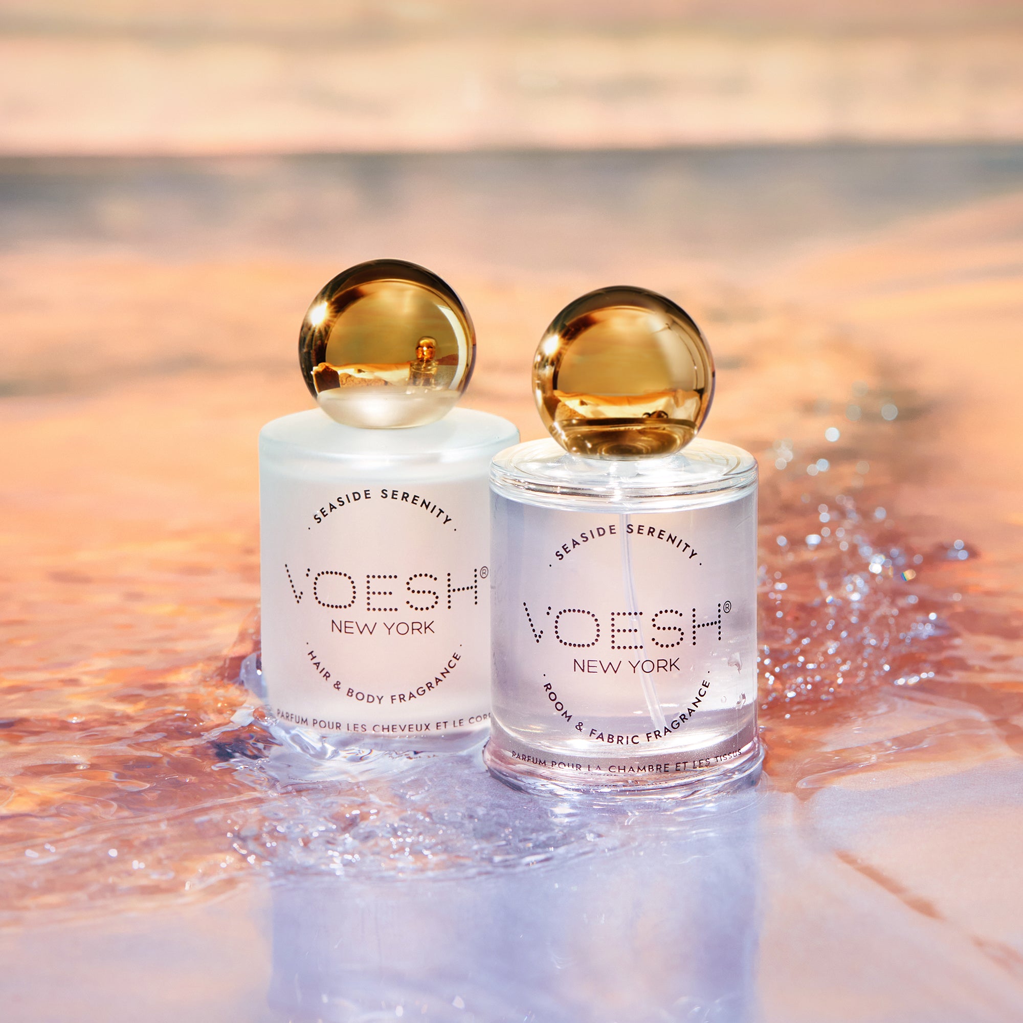 Hair & Body Fragrance and Room & Fabric Fragrance on top of water with a beachy background.